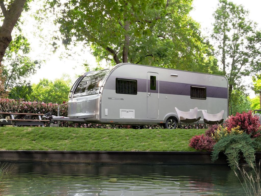 Adria caravan being towed on the road